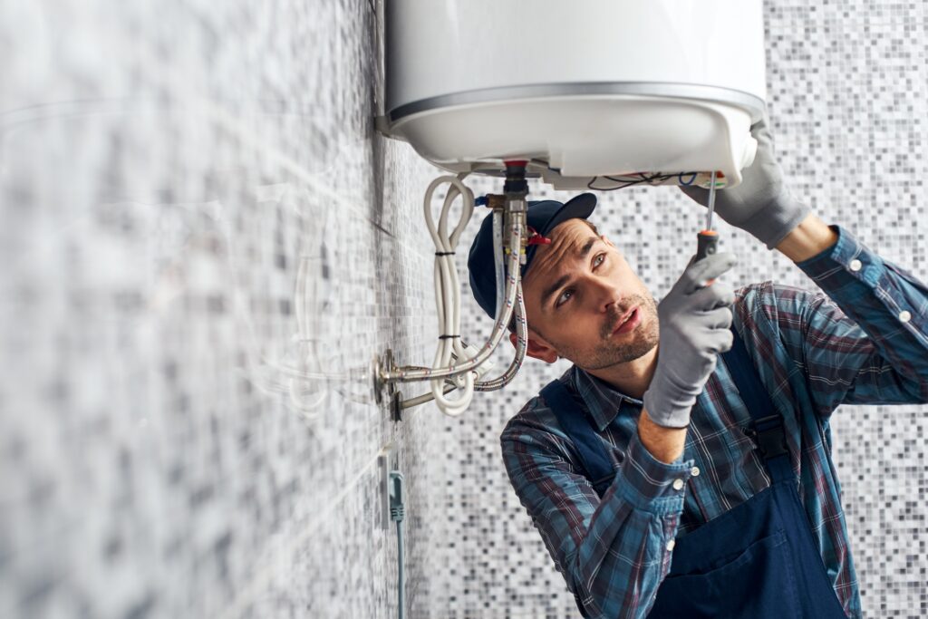 Climatisation chauffage et plomberie à Lyon Ankial - almost done worker set up electric heating boiler at home bathroom Ankial Ankial https://climatisation-lyon.com climatisation reversible climatisation reversible