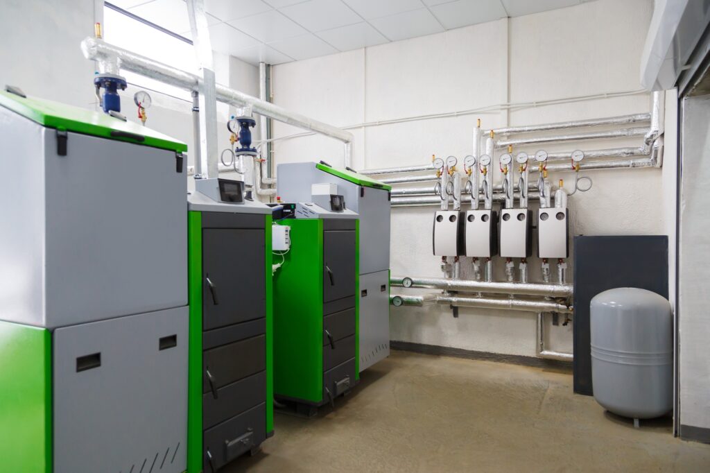 Climatisation chauffage et plomberie à Lyon Ankial - large industrial boiler room with appliance using pallets as a fuel Ankial Ankial https://climatisation-lyon.com climatisation lyon climatisation lyon,chauffagiste lyon,plomberie lyon