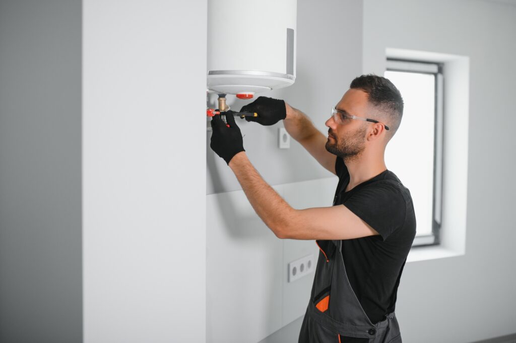 Climatisation chauffage et plomberie à Lyon Ankial - professional plumber checking a boiler and pipes boiler service concept 1 Ankial Ankial https://climatisation-lyon.com plombier lyon plombier lyon